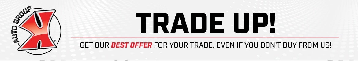 An ad from X Auto Group for TRADE UP! offering the BEST OFFER FOR YOUR TRADE, EVEN IF YOU DON'T BUY FROM US!