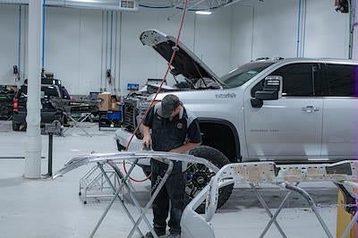 Karl GMC of Marshalltown Certified Service technician working on a GMC vehicle